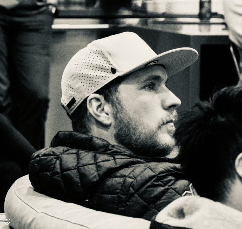 Zack Warren, side profile in a white cap